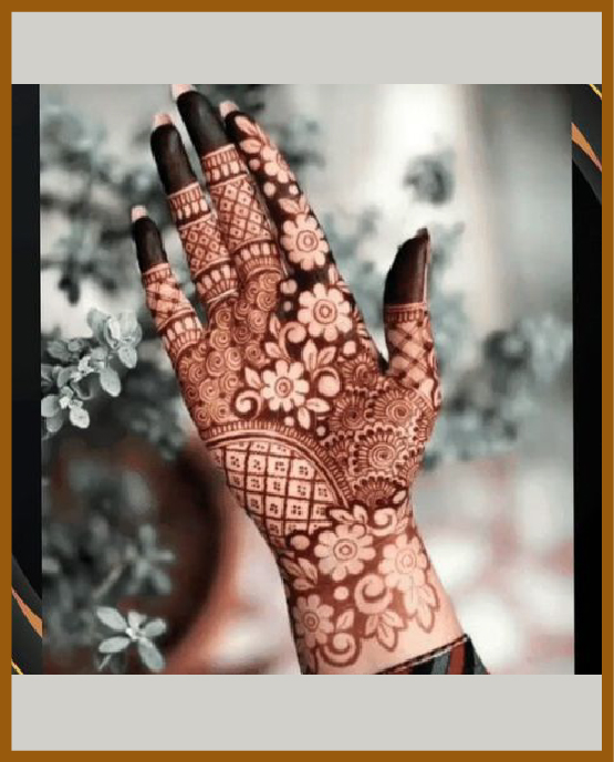Central floral pattern in royal front hand mehndi design Central floral pattern in royal front hand mehndi design